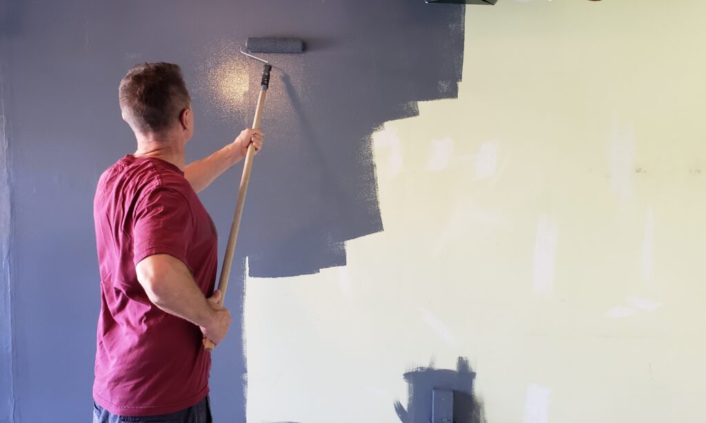 residential painter painting a wall blue