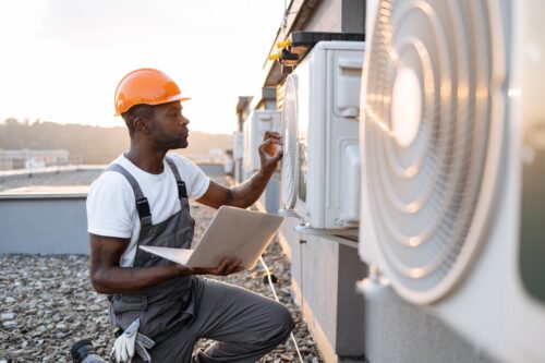 hvac professional repairing unit using