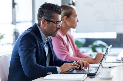 coworkers in office using managed IT services built specifically for cpa firms
